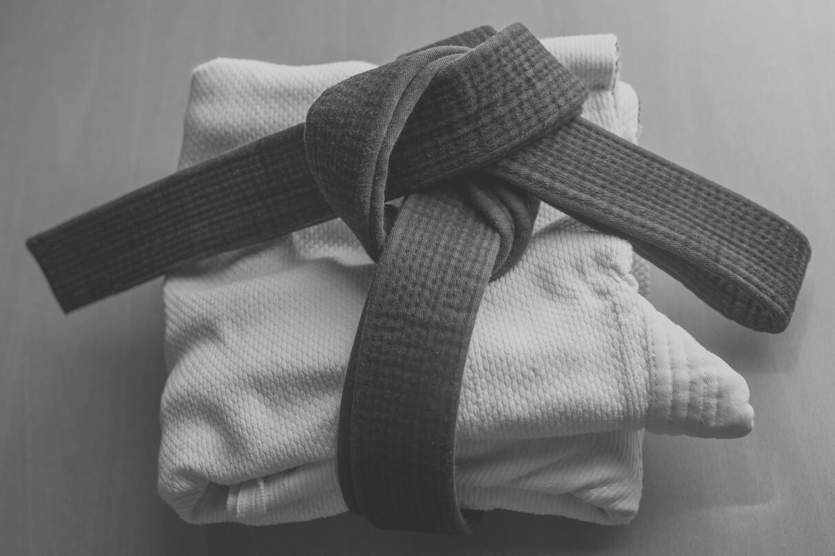 Tying her taekwondo belt.