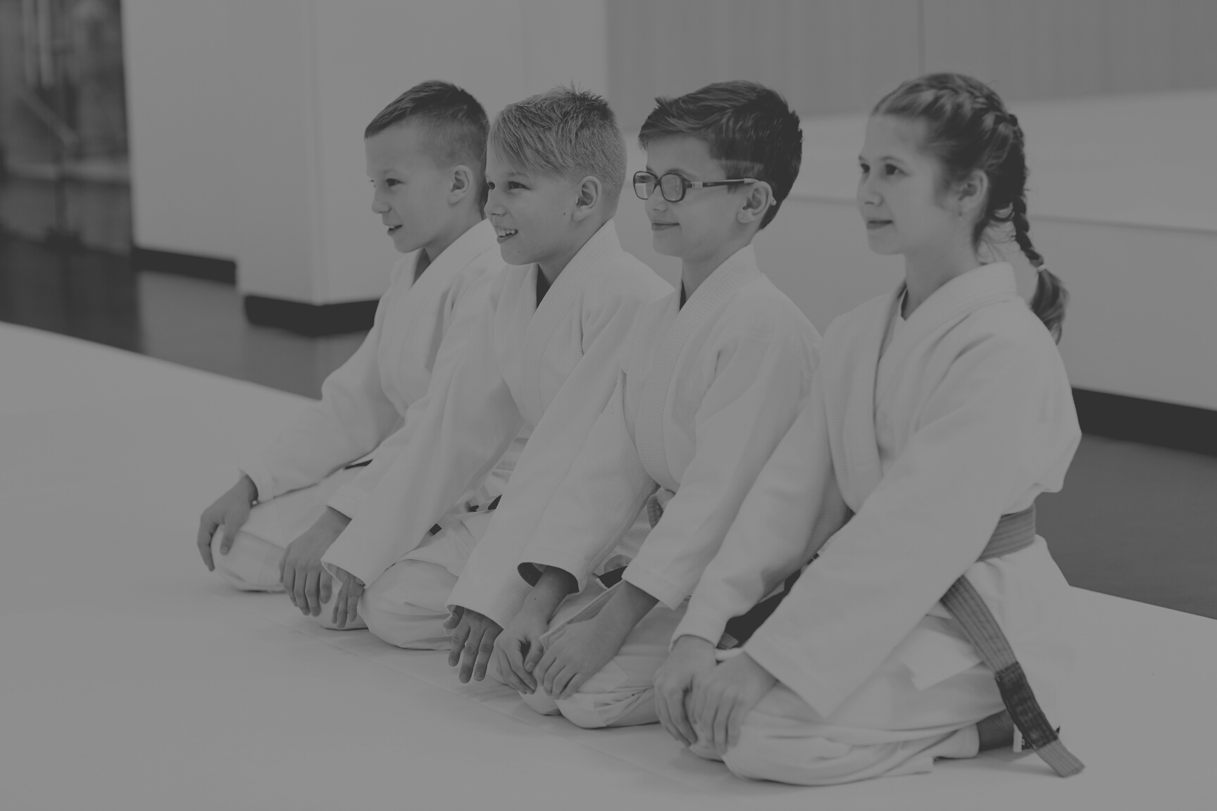 Young judoists doing judo